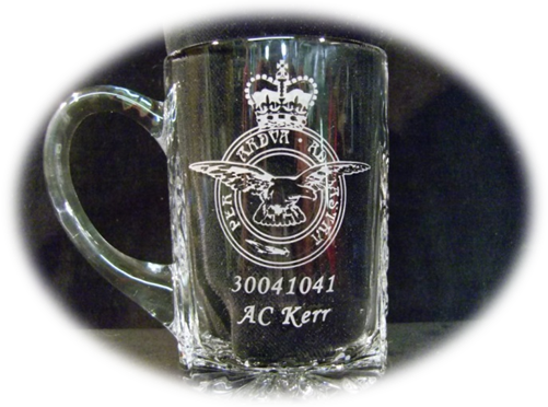 This is a one pint plain crystal tankard which has been engraved by sandblating the Royal Air Force Emblem and the name of the new recruit who has just passed his initial training. It was presented in a blue silk lined box.