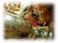 A Hand engrager at work on a Silver Trophy. This is the traditional way of engraving using a graver or burin.