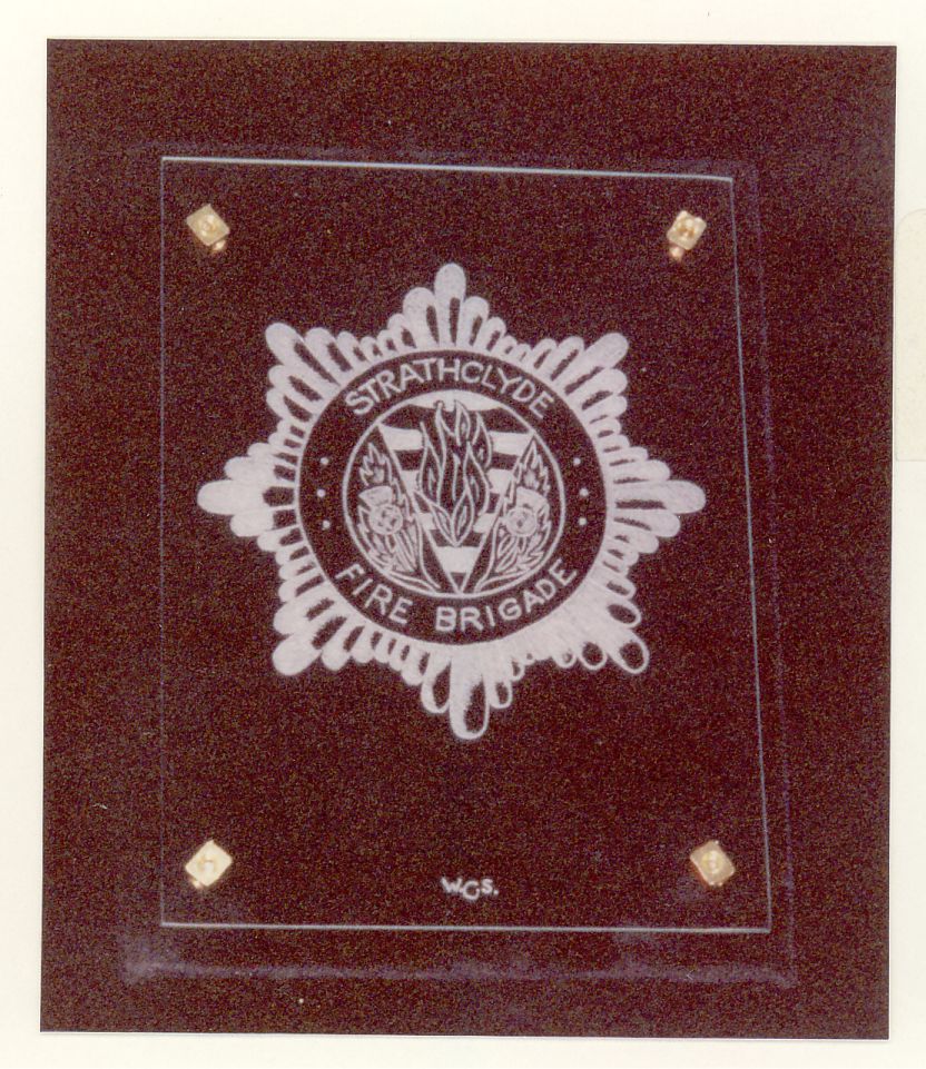 Strathclyde Fire Service. A Hand engraving on flat glass of the badge of the Strathclyde Fire Service Completed as a Practice piece.
